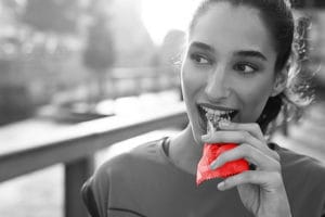 Women Eating a protein bar