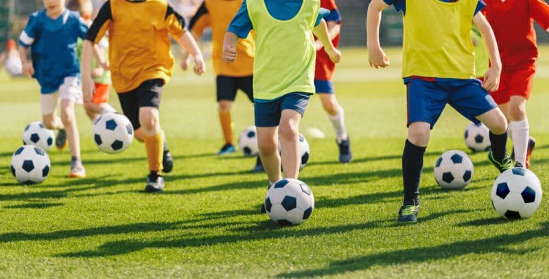 Football,Soccer,Children,Training,Class.,Kids,Practicing,Football,On,Grass