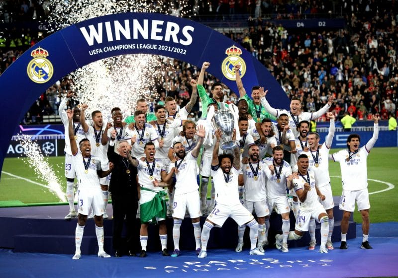 Real Madrid players celebrate lifting the trophy after winning the UEFA