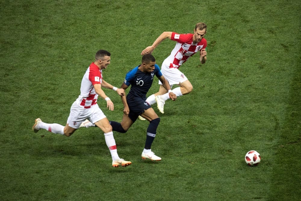 France's forward Mbappe runs from Croatian players. World Cup 2018 final match France vs Croatia. "Luzhniki" Stadium, 15th July 2018.