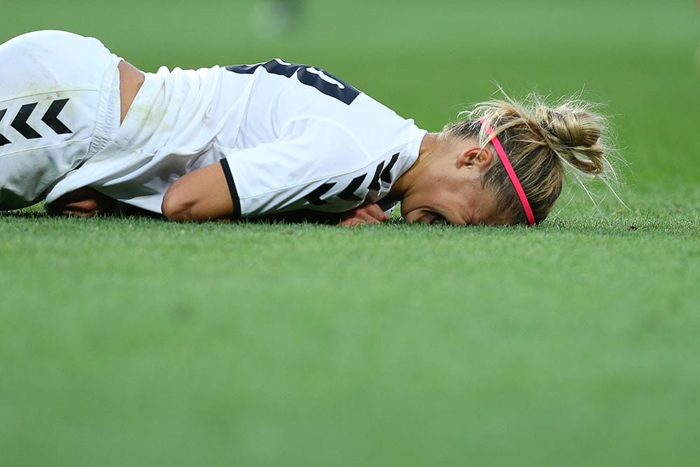 AUGUST 13, 2018 - KHARKIV, UKRAINE: Ganna Voronina close-up portrait falling down on the pitch with injury after hard collision. UEFA Women's Champions League. WFC Kharkiv - Olimpia Cluj.