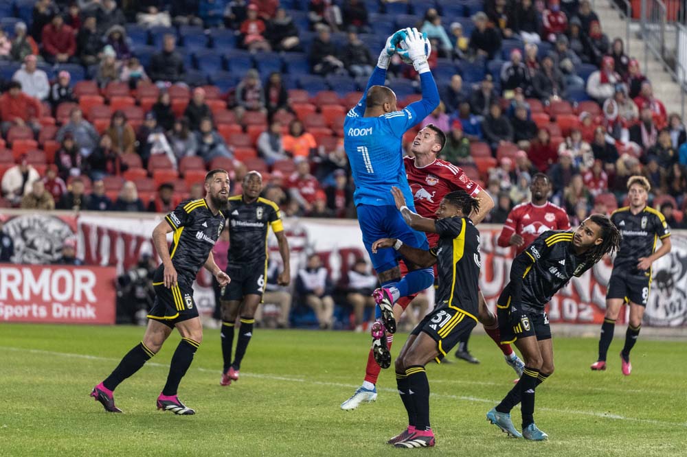 Goalkeeper Eloy Room (1) of Columbus Crew saves during MLS regular season match against Red Bulls at Red Bull Arena in Harrison, NJ on March 18, 2023
