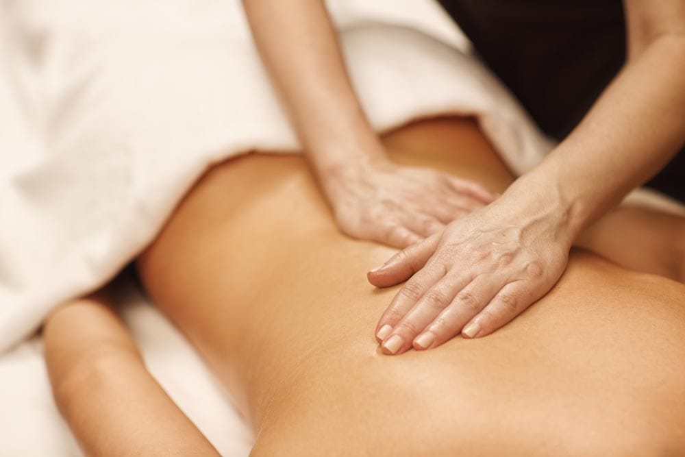 Close up cropped shot of a professional masseuse working massaging back of a woman relaxation pampering treatment beauty health lifestyle peace anti-stress relief job occupation professionalism skills