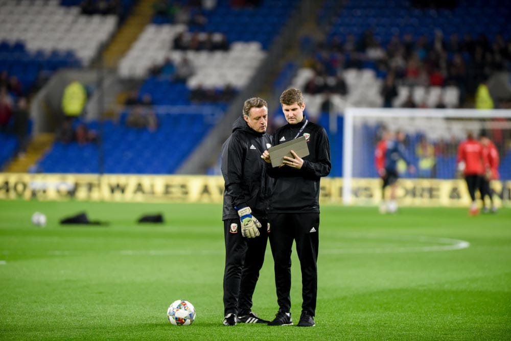 Wales v Denmark, Uefa Nations League, Cardiff City Stadium, 16/11/18: Welsh goalkeeping coach Tony Roberts discusses things with an analyst