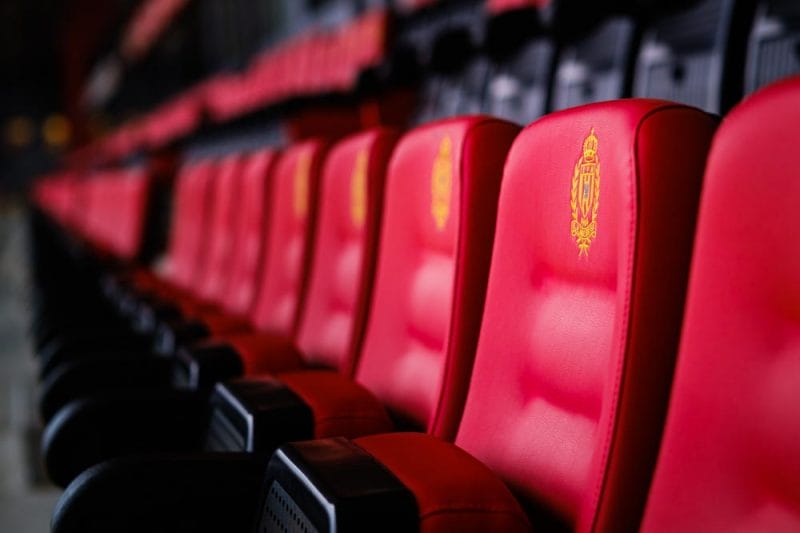 A selective focus of detail on the red seats in the AFAS football station of KV Mechelen, Belgium