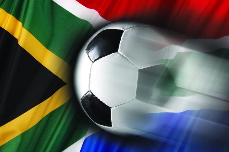 Soccer ball streaks across flag of South Africa