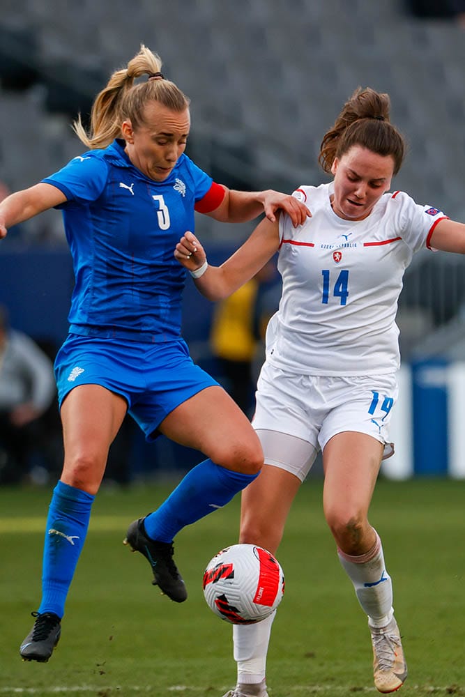 Czech Republic's Klara Cvrckova (14) and Iceland's Elisa Vioarsdottir (3) vie for the ball during the She Believes Cup soccer match Feb. 20, 2022, in Carson, Calif.